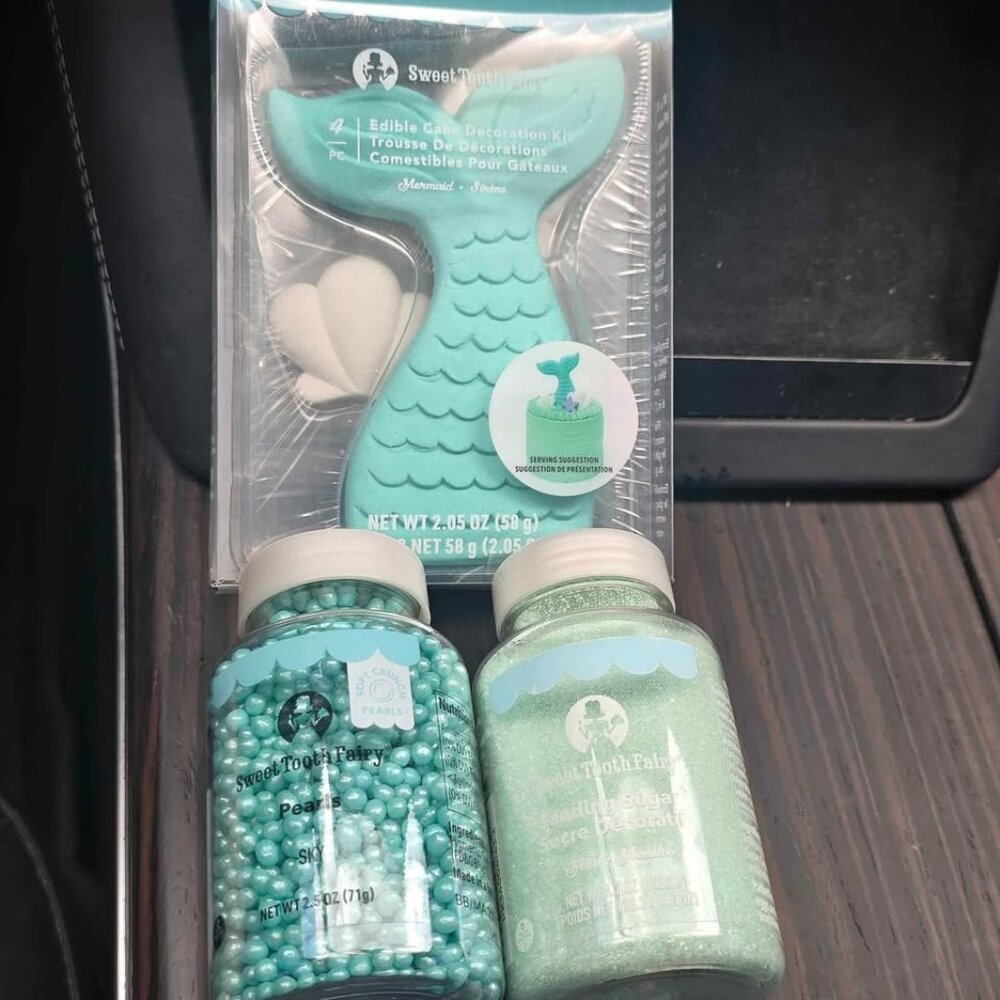 Mermaid birthday cake toppers and  sprinkles all new in box unopened. Birthday d